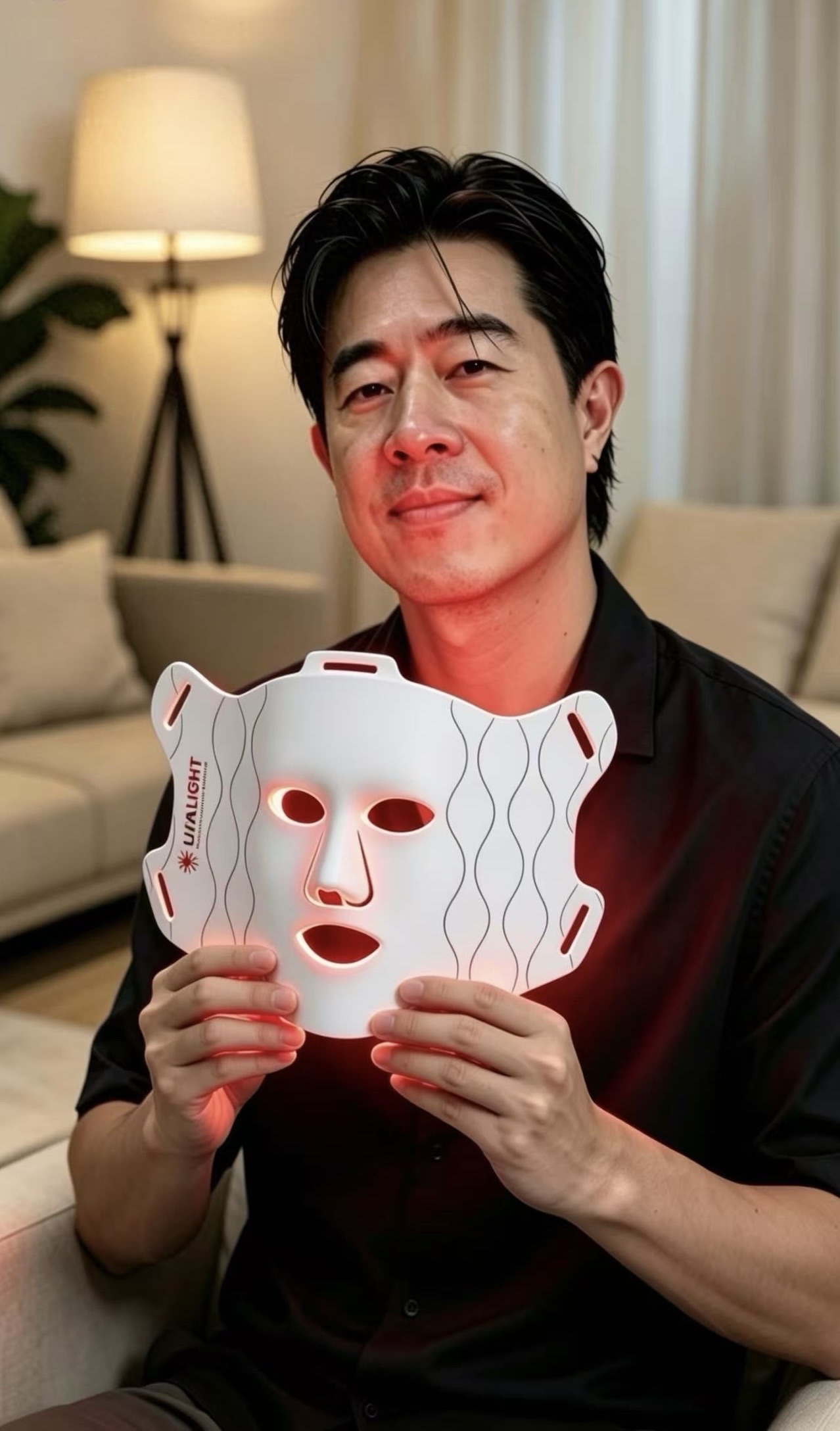 Hugh using a Lufalight red light therapy mask at home
